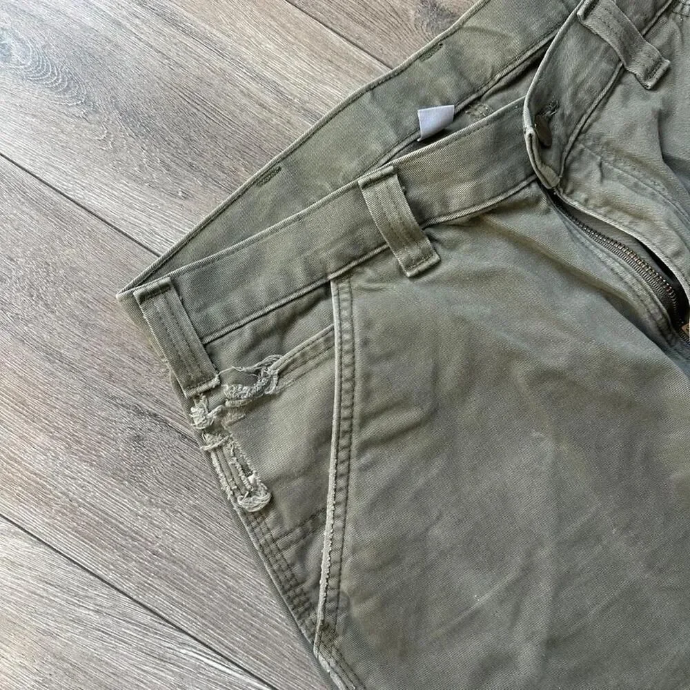 Distressed Carhartt relaxed fit olive green pants some staining  Size 34 x 34